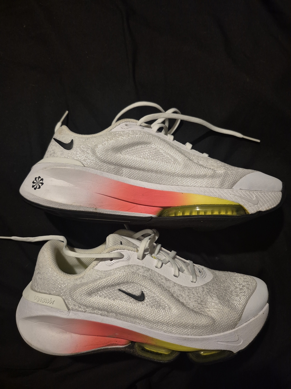 NikeVoltaire White Athletic Shoes with Pink and Yellow Accents